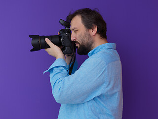 Image showing Portrait of  male Photographer purple background