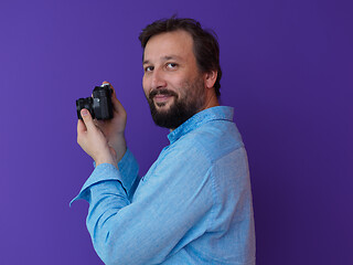 Image showing Portrait of  male Photographer purple background