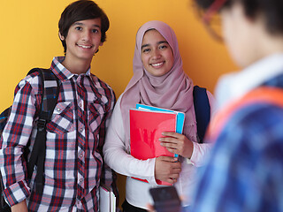 Image showing Arab teenagers group working on laptop  computer together