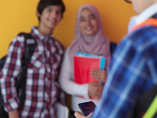 Image showing Arab teenagers group working on laptop  computer together