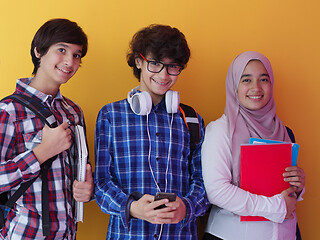 Image showing Arab teenagers group working on laptop  computer together