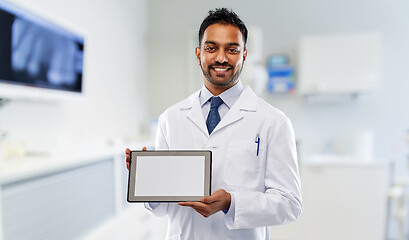 Image showing male dentist with tablet computer at dental clinic