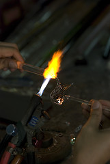 Image showing Artist making a bird of glass