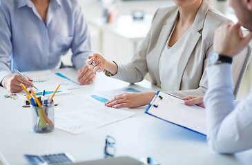 Image showing business team discussing charts at office