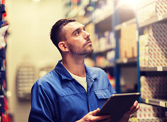 Image showing auto mechanic or smith with tablet pc at workshop