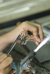 Image showing Artist making a glass bird