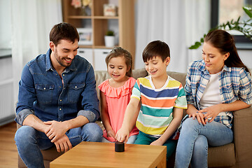 Image showing happy family with smart speaker at home