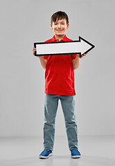 Image showing boy holding big white rightwards thick arrow