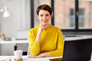 Image showing businesswoman with laptop computer at office