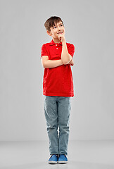 Image showing thinking boy in red polo t-shirt