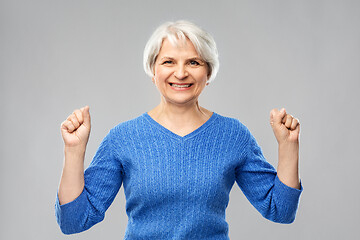 Image showing portrait of happy senior woman celebrating success