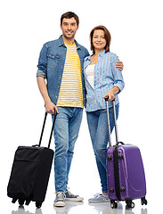 Image showing happy couple of tourists with travel bags