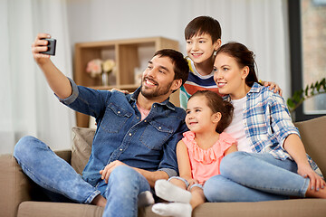 Image showing happy family taking selfie at home