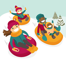Image showing Multiethnic family sliding down the hill on tubes.