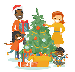 Image showing Multiethnic family decorating the Christmas tree.