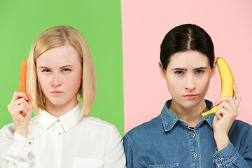 Image showing Beautiful close-up portrait of young women with fruits and vegetables. Healthy food concept.