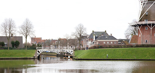 Image showing Dokkum, the Netherlands on December 26, 2019: Canal and windmill