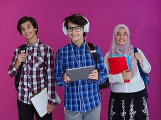 Image showing Arab teenagers group working on laptop  computer together