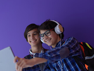 Image showing Arab teenagers group working on laptop  computer together