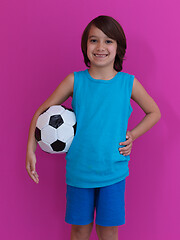 Image showing Arabic boy with soccer ball against  pink background