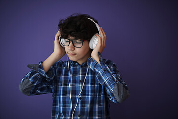 Image showing Teenage Boy Wearing Headphones And Listening To Music