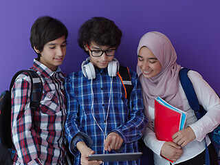 Image showing Arab teenagers group working on laptop  computer together