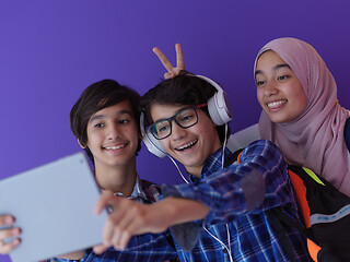 Image showing Arab teenagers group working on laptop  computer together