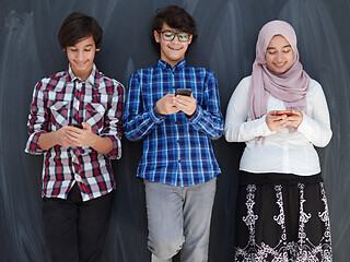 Image showing arab teenagers group using smart phones for social media network