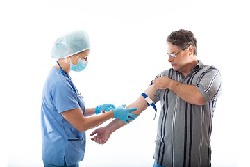 Image showing Patient receives a blood test from nurse or pathologist