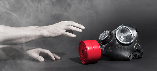 Image showing Man in room filled with smoke, trying to reach for vintage gasma