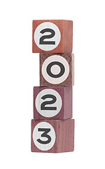 Image showing Four isolated hardwood toy blocks, saying 2023