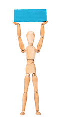 Image showing Wooden mannequin carrying a wooden block