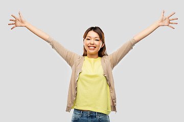 Image showing happy asian woman celebrating success