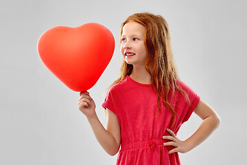 Image showing smiling red haired girl with heart shaped balloon