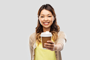 Image showing happy asian woman drinking coffee