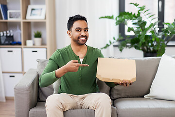 Image showing indian man with box of takeaway pizza at home