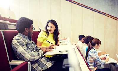 Image showing group of students with notebooks at lecture hall