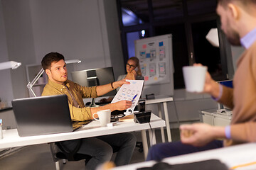 Image showing designers or software developers at night office