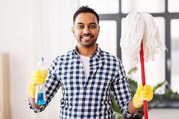 Image showing indian man with mop and detergent cleaning at home