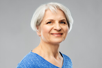 Image showing portrait of smiling senior woman in blue sweater