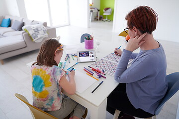 Image showing Mother and little daughter  playing together  drawing creative a