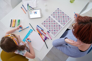 Image showing Mother and little daughter  playing together  drawing creative a