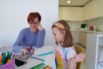 Image showing Mother and little daughter  playing together  drawing creative a