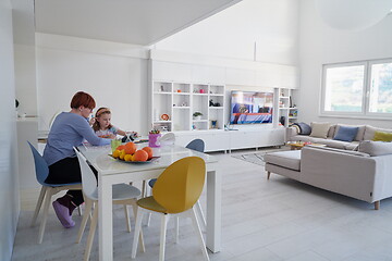 Image showing Mother and little daughter  playing together  drawing creative a