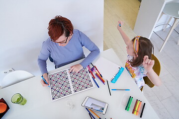 Image showing Mother and little daughter  playing together  drawing creative a