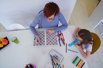 Image showing Mother and little daughter  playing together  drawing creative a