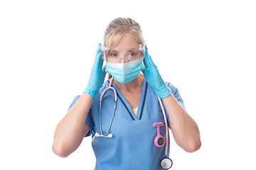 Image showing Nurse putting on protective mask gloves and goggles