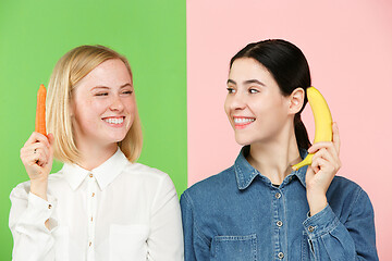 Image showing Beautiful close-up portrait of young women with fruits and vegetables. Healthy food concept.