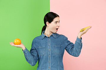 Image showing Beautiful close-up portrait of young woman with fruits. Healthy food concept.