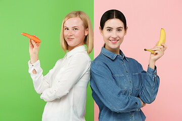 Image showing Beautiful close-up portrait of young women with fruits and vegetables. Healthy food concept.